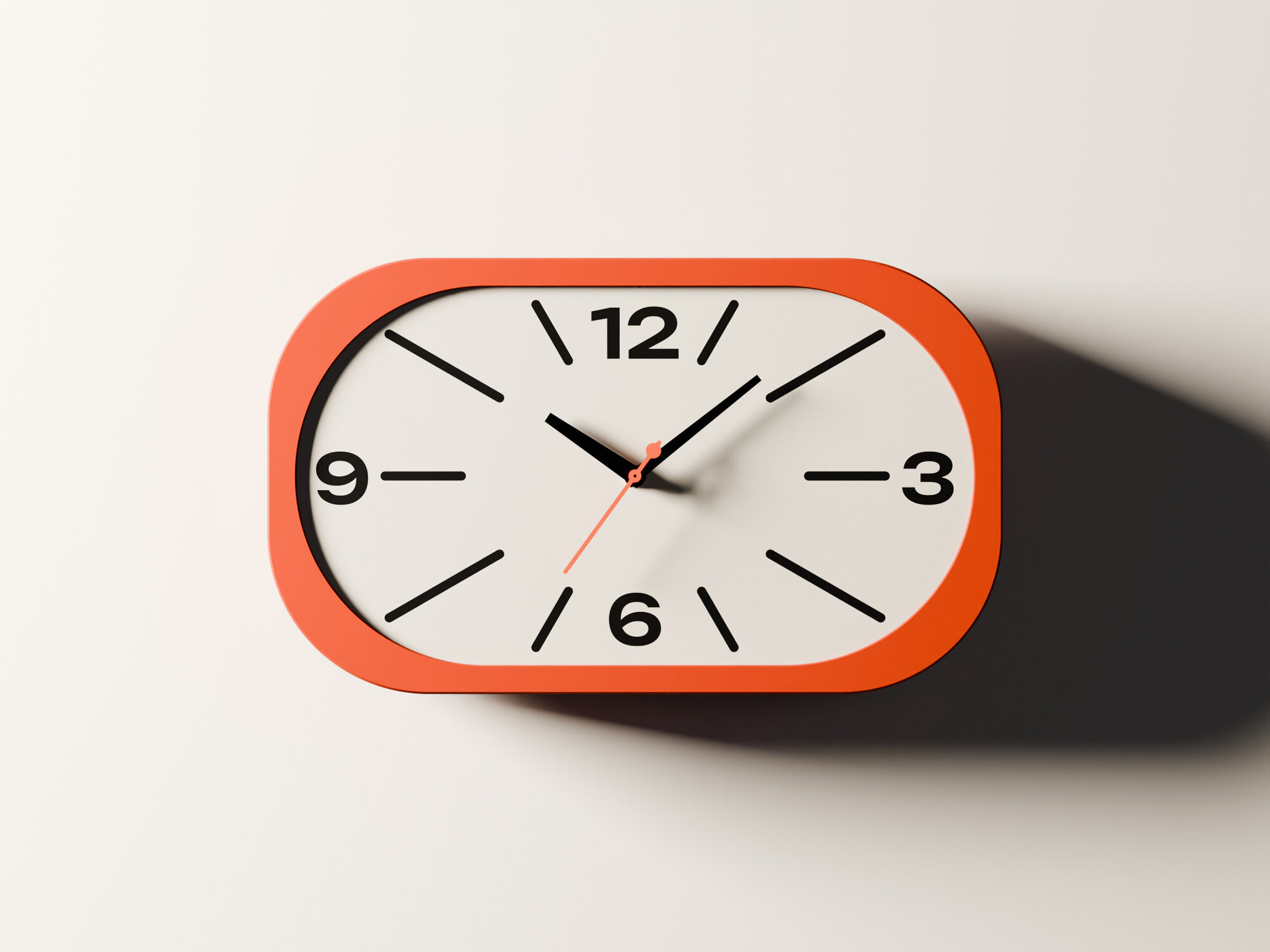 The clock straight on, orange frame, off-white dial, black numerals.